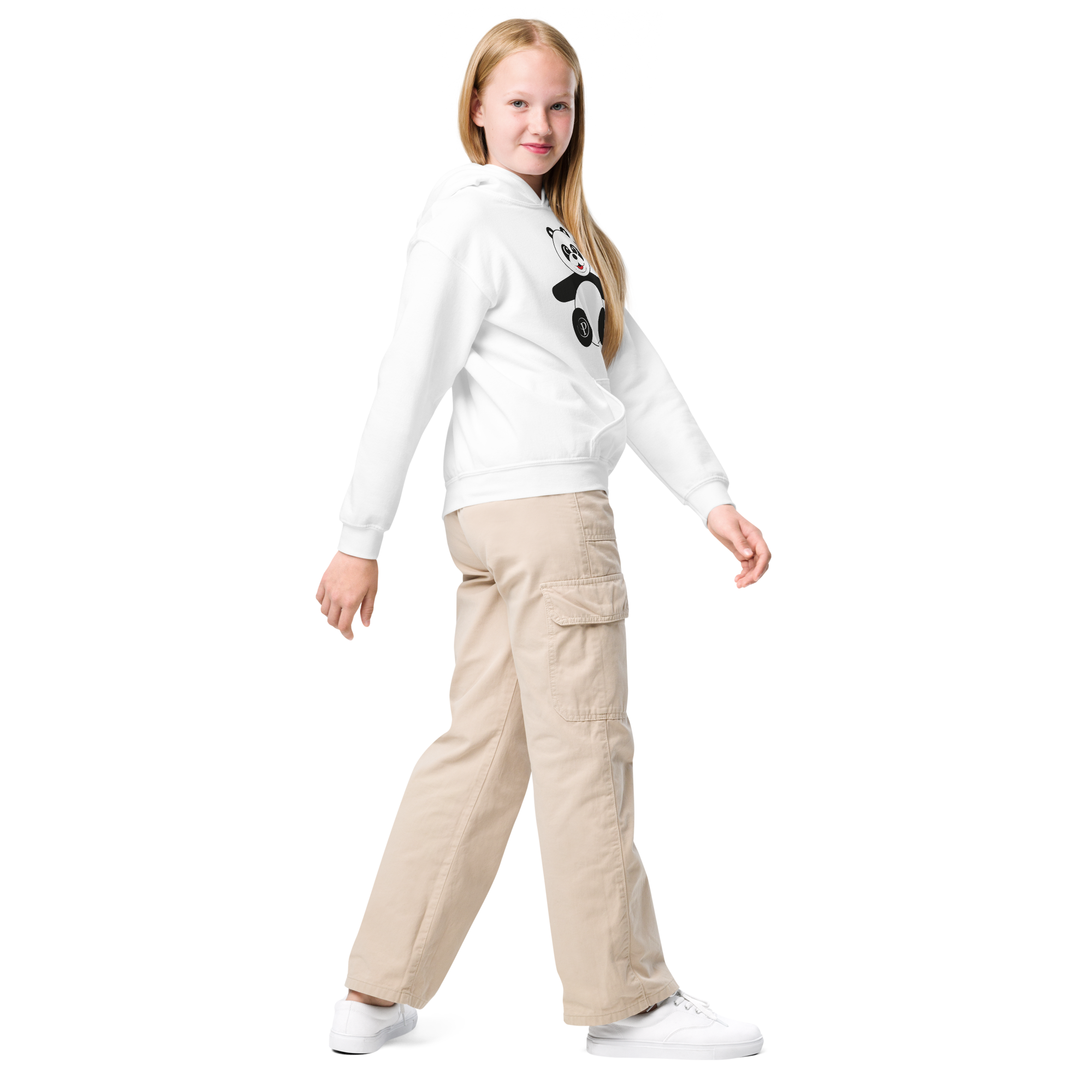 Young girl wearing a white sweater with a panda design and beige cargo pants on a white background
